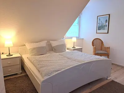 Ein Bett oder Betten in einem Zimmer der Unterkunft Bahnhofstrasse 5 Wohnung Zingst