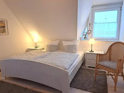 Ein Bett oder Betten in einem Zimmer der Unterkunft Bahnhofstrasse 5 Wohnung Zingst