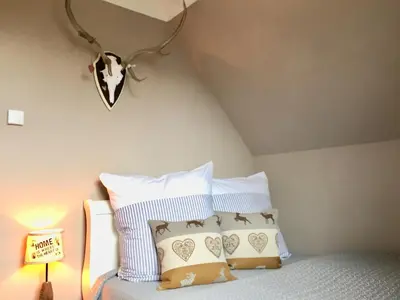 Ein Bett oder Betten in einem Zimmer der Unterkunft Wiesenstraße 65 Haus Wilderei