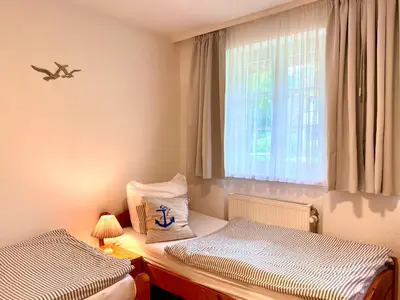 Ein Bett oder Betten in einem Zimmer der Unterkunft Achtern Diek Haus 9 Wohnung 2