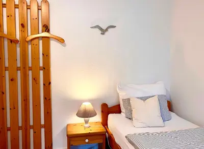 Ein Bett oder Betten in einem Zimmer der Unterkunft Achtern Diek Haus 9 Wohnung 2