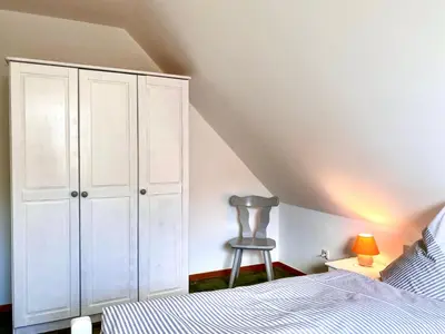 Ein Bett oder Betten in einem Zimmer der Unterkunft Hägerende 66 Haus Windrose Wohnung Ostwind
