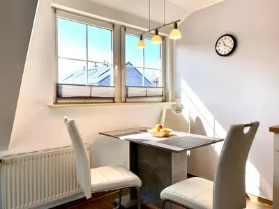 Ein Sitzbereich in der Unterkunft Hägerende 66 Haus Windrose Wohnung Ostwind