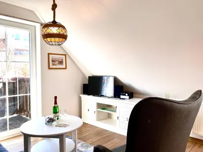 Ein Sitzbereich in der Unterkunft Hägerende 66 Haus Windrose Wohnung Ostwind