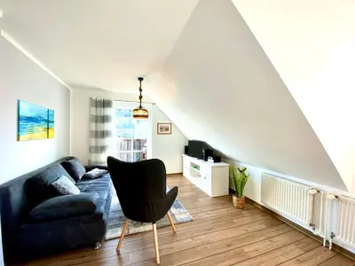 Ein Sitzbereich in der Unterkunft Hägerende 66 Haus Windrose Wohnung Ostwind