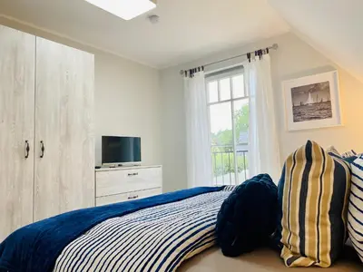 Ein Bett oder Betten in einem Zimmer der Unterkunft Schwalbennest 2