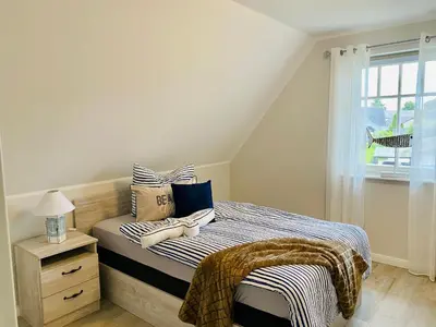 Ein Bett oder Betten in einem Zimmer der Unterkunft Schwalbennest 2