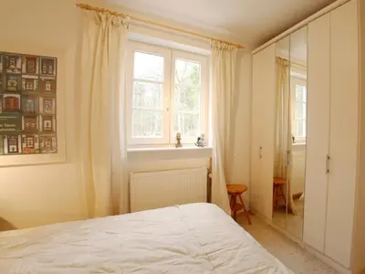 Ein Bett oder Betten in einem Zimmer der Unterkunft Achtern Diek Haus 11 Wohnung 1