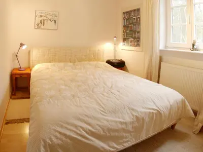 Ein Bett oder Betten in einem Zimmer der Unterkunft Achtern Diek Haus 11 Wohnung 1