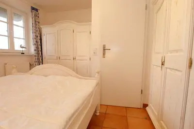 Ein Bett oder Betten in einem Zimmer der Unterkunft Achtern Diek Haus 12b Wohnung 2