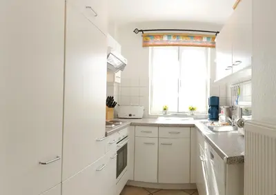 Küche/Küchenzeile in der Unterkunft Achtern Diek Haus 12c Wohnung 4
