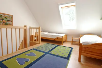 Ein Bett oder Betten in einem Zimmer der Unterkunft Neue Reihe 19a Haus Bodden & Meer