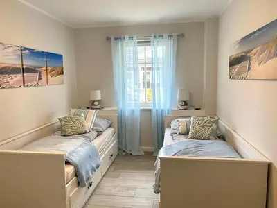 Ein Bett oder Betten in einem Zimmer der Unterkunft Schwalbennest 1