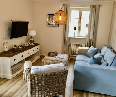 Ein Sitzbereich in der Unterkunft Achtern Diek Haus 13b Wohnung 3