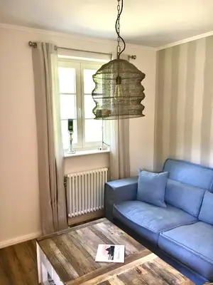 Ein Sitzbereich in der Unterkunft Achtern Diek Haus 13b Wohnung 3