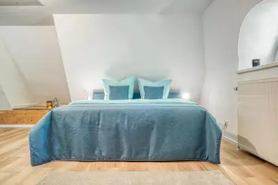 Ein Bett oder Betten in einem Zimmer der Unterkunft Achtern Diek Haus 13b Wohnung 6