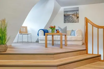 Ein Sitzbereich in der Unterkunft Achtern Diek Haus 13b Wohnung 6