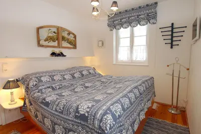 Ein Bett oder Betten in einem Zimmer der Unterkunft Achtern Diek Haus 13d Wohnung 3