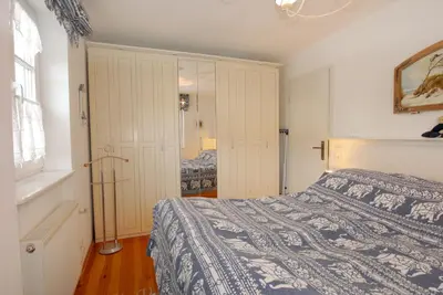Ein Bett oder Betten in einem Zimmer der Unterkunft Achtern Diek Haus 13d Wohnung 3