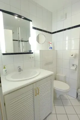 Ein Badezimmer in der Unterkunft Achtern Diek Haus 13d Wohnung 6