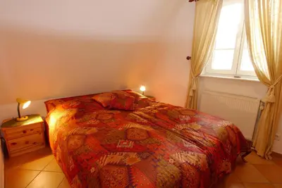 Ein Bett oder Betten in einem Zimmer der Unterkunft Achtern Diek Haus 13d Wohnung 6