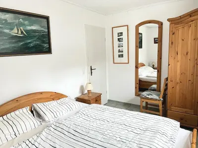 Ein Bett oder Betten in einem Zimmer der Unterkunft Achtern Diek Haus 15d Wohnung 3