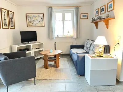 Ein Sitzbereich in der Unterkunft Achtern Diek Haus 15d Wohnung 3