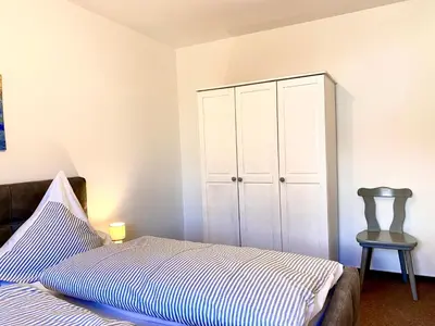 Ein Bett oder Betten in einem Zimmer der Unterkunft Hägerende 66 Haus Windrose Wohnung Westwind