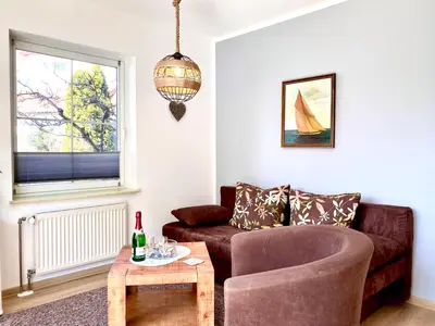 Ein Sitzbereich in der Unterkunft Hägerende 66 Haus Windrose Wohnung Westwind