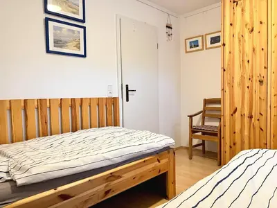 Ein Bett oder Betten in einem Zimmer der Unterkunft Achtern Diek Haus 15d Wohnung 6