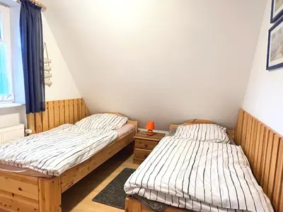 Ein Bett oder Betten in einem Zimmer der Unterkunft Achtern Diek Haus 15d Wohnung 6