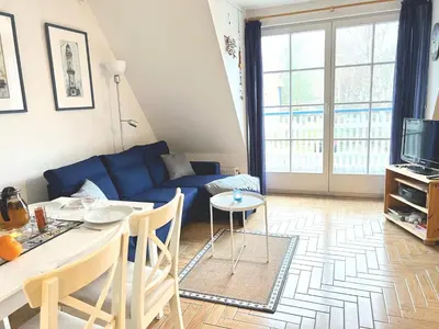 Ein Sitzbereich in der Unterkunft Achtern Diek Haus 15d Wohnung 6