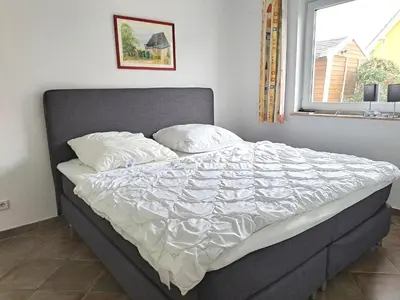 Ein Bett oder Betten in einem Zimmer der Unterkunft Zur Wellenwiese 22 Wohnung Sanderling