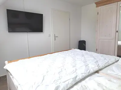 Ein Bett oder Betten in einem Zimmer der Unterkunft Zur Wellenwiese 22 Wohnung Kiebitz