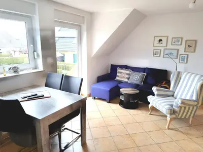 Ein Sitzbereich in der Unterkunft Zur Wellenwiese 22 Wohnung Kiebitz