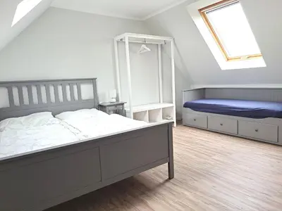 Ein Bett oder Betten in einem Zimmer der Unterkunft Zur Wellenwiese 22 Wohnung Kiebitz