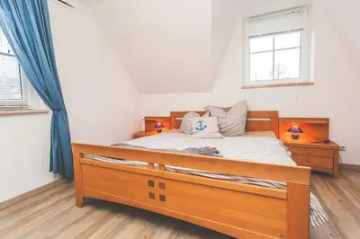 Ein Bett oder Betten in einem Zimmer der Unterkunft Am Bahndamm 81a Haus Schwalbe