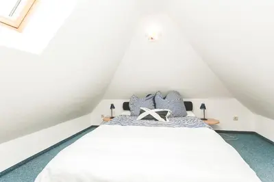 Ein Bett oder Betten in einem Zimmer der Unterkunft Am Bahndamm 81a Haus Schwalbe