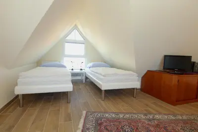 Ein Bett oder Betten in einem Zimmer der Unterkunft Boddenblick Wohnung 30