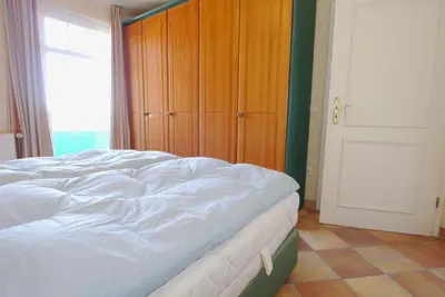 Ein Bett oder Betten in einem Zimmer der Unterkunft Boddenblick Wohnung 30
