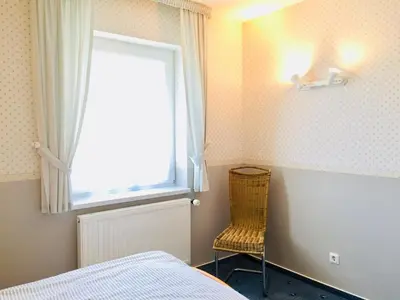 Ein Bett oder Betten in einem Zimmer der Unterkunft Kavelweg 12 Wohnung Arkona