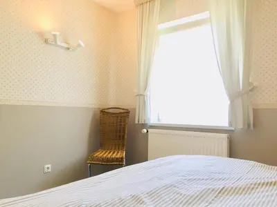 Ein Bett oder Betten in einem Zimmer der Unterkunft Kavelweg 12 Wohnung Arkona