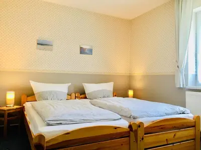 Ein Bett oder Betten in einem Zimmer der Unterkunft Kavelweg 12 Wohnung Arkona