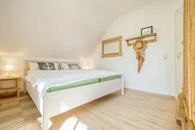 Ein Bett oder Betten in einem Zimmer der Unterkunft Alte Reihe 9 Haus Am Wind 6