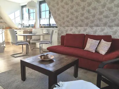 Ein Sitzbereich in der Unterkunft Ferienwohnung Malvenhaus
