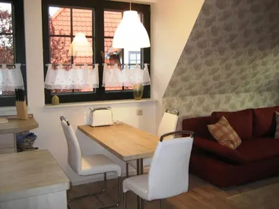 Ein Sitzbereich in der Unterkunft Ferienwohnung Malvenhaus