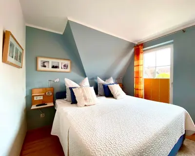 Ein Bett oder Betten in einem Zimmer der Unterkunft Mine-Heimat-Weg 18 Haus Dünenfee