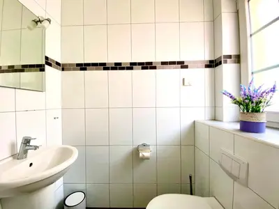 Ein Badezimmer in der Unterkunft Mine-Heimat-Weg 18 Haus Dünenfee