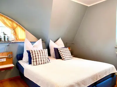 Ein Bett oder Betten in einem Zimmer der Unterkunft Mine-Heimat-Weg 18 Haus Dünenfee