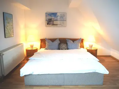 Ein Bett oder Betten in einem Zimmer der Unterkunft Boddenblick Wohnung 29
